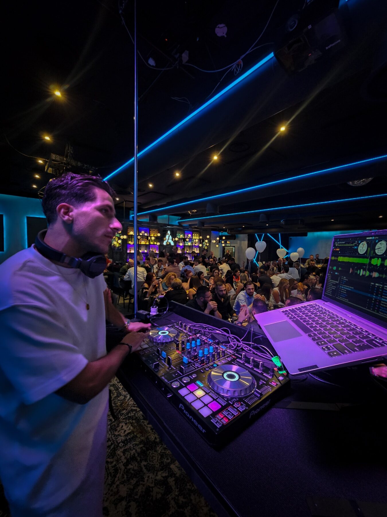 DJ Vrontis performing inside a club